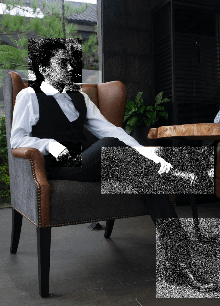 a blurry photo of a person standing in front of a wall