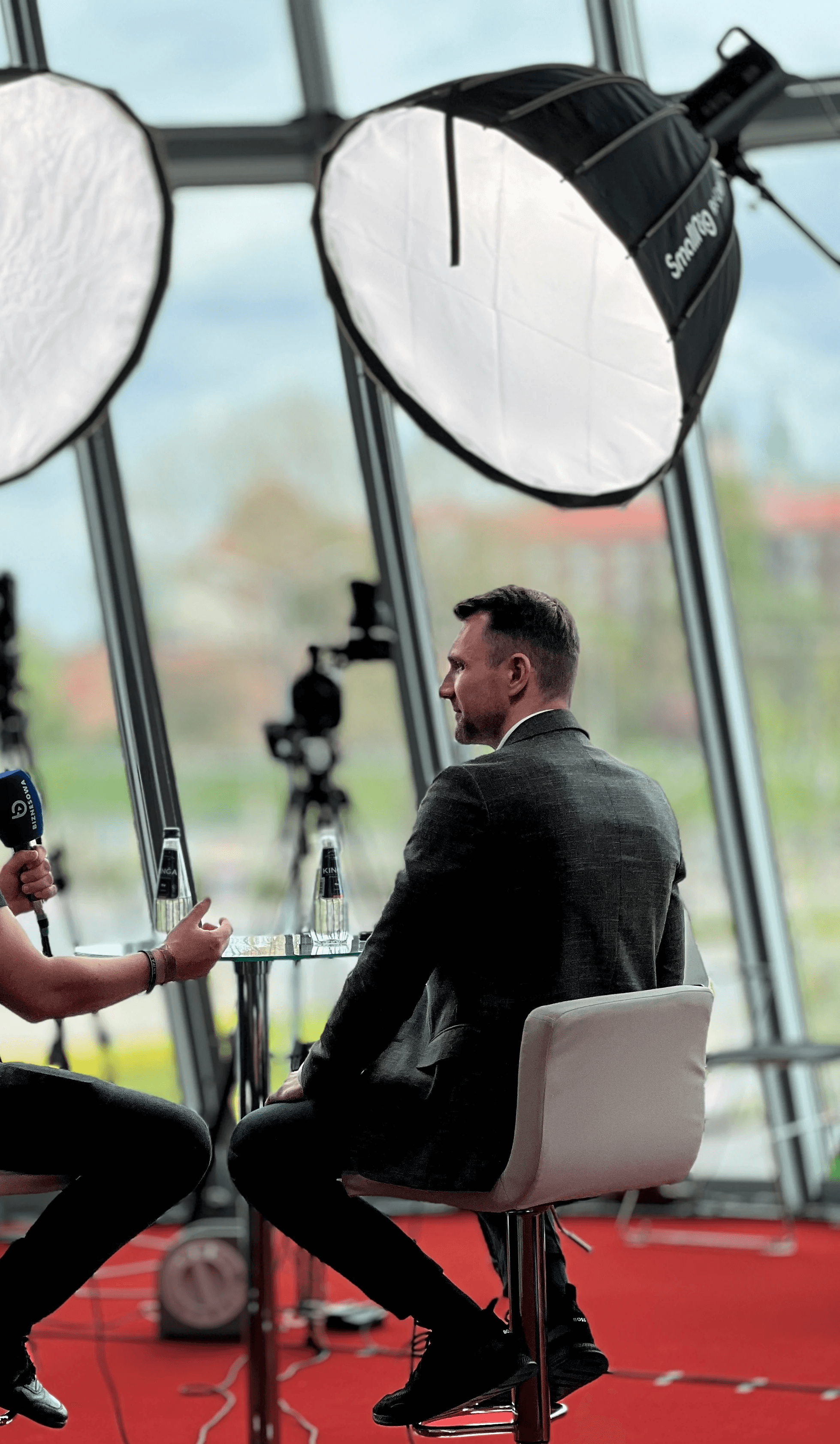 Person in a white off-shoulder top using a MacBook laptop, with text overlay 'What's new in digital?' and the fabrica® logo in the top corner.