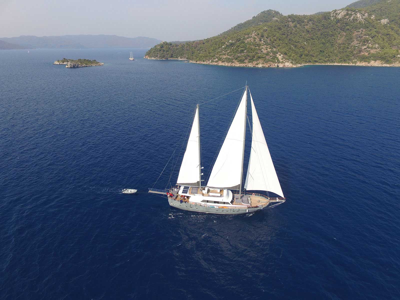 Golden desert cliffs in AlUla under soft afternoon light.