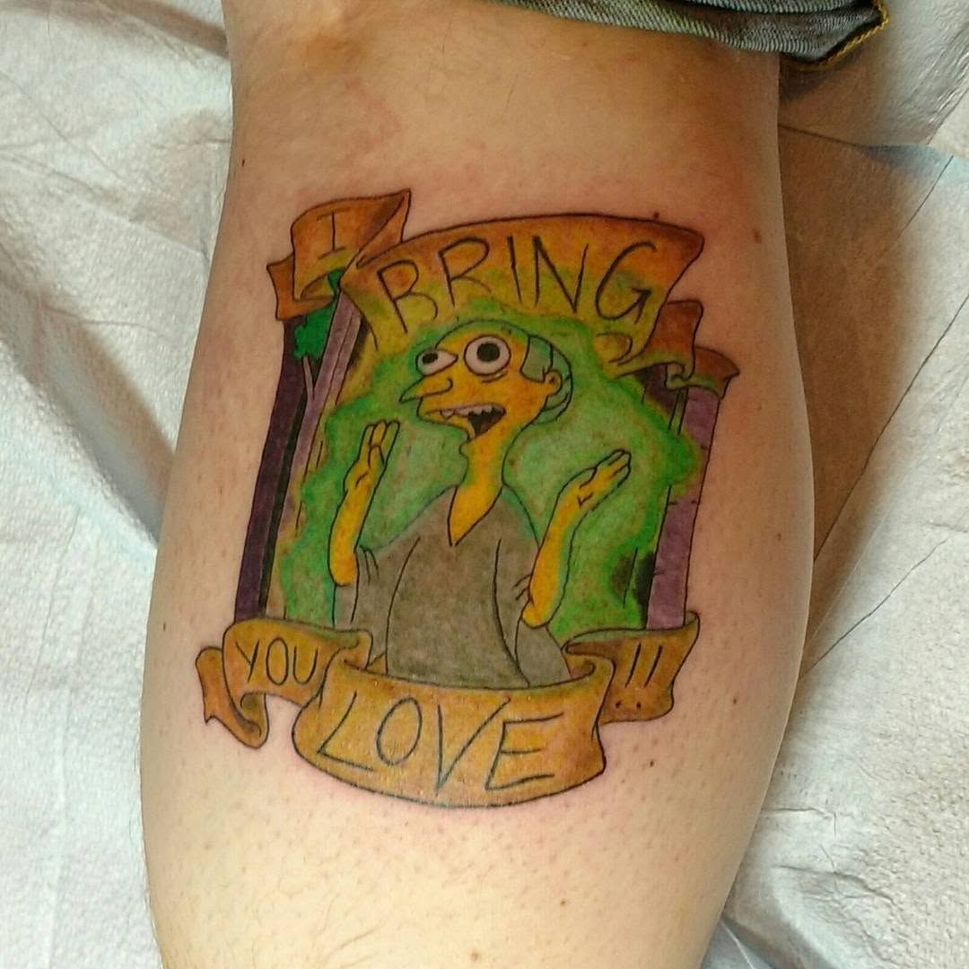 Colour cartoon frog "Bring You Love" tattoo on a lower leg