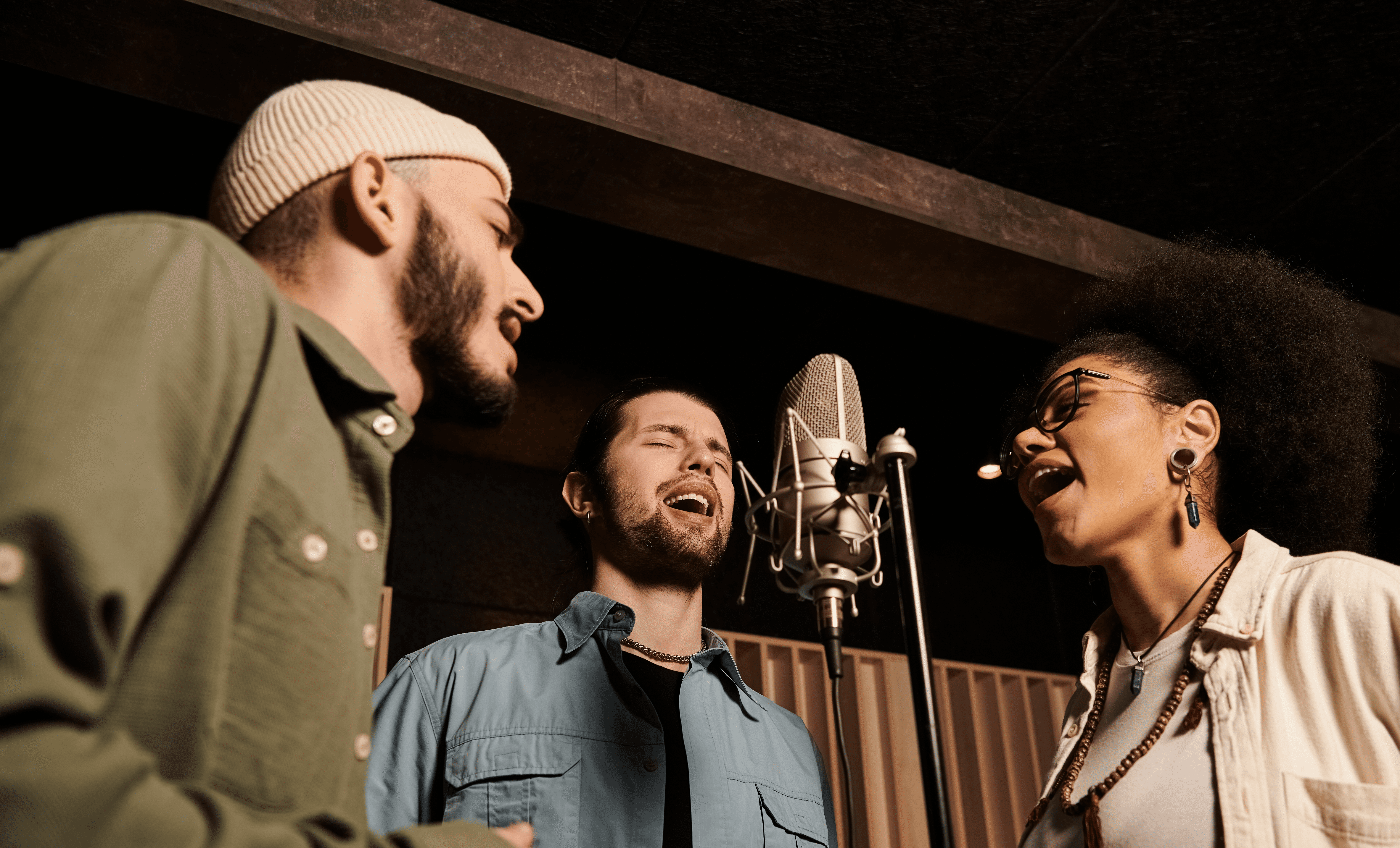 Multiple vocalists singing into the same mic in the recording studio
