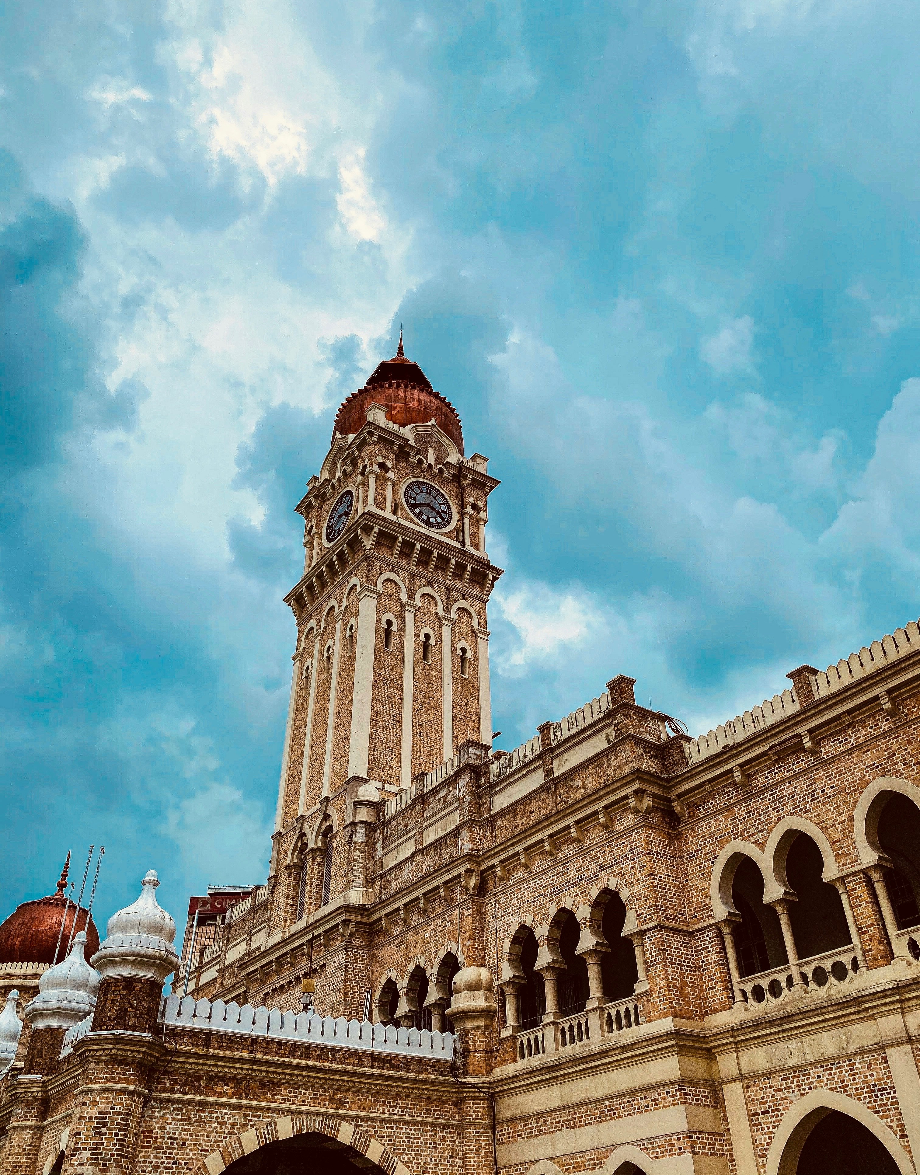 brown concrete building under blue sky during daytime