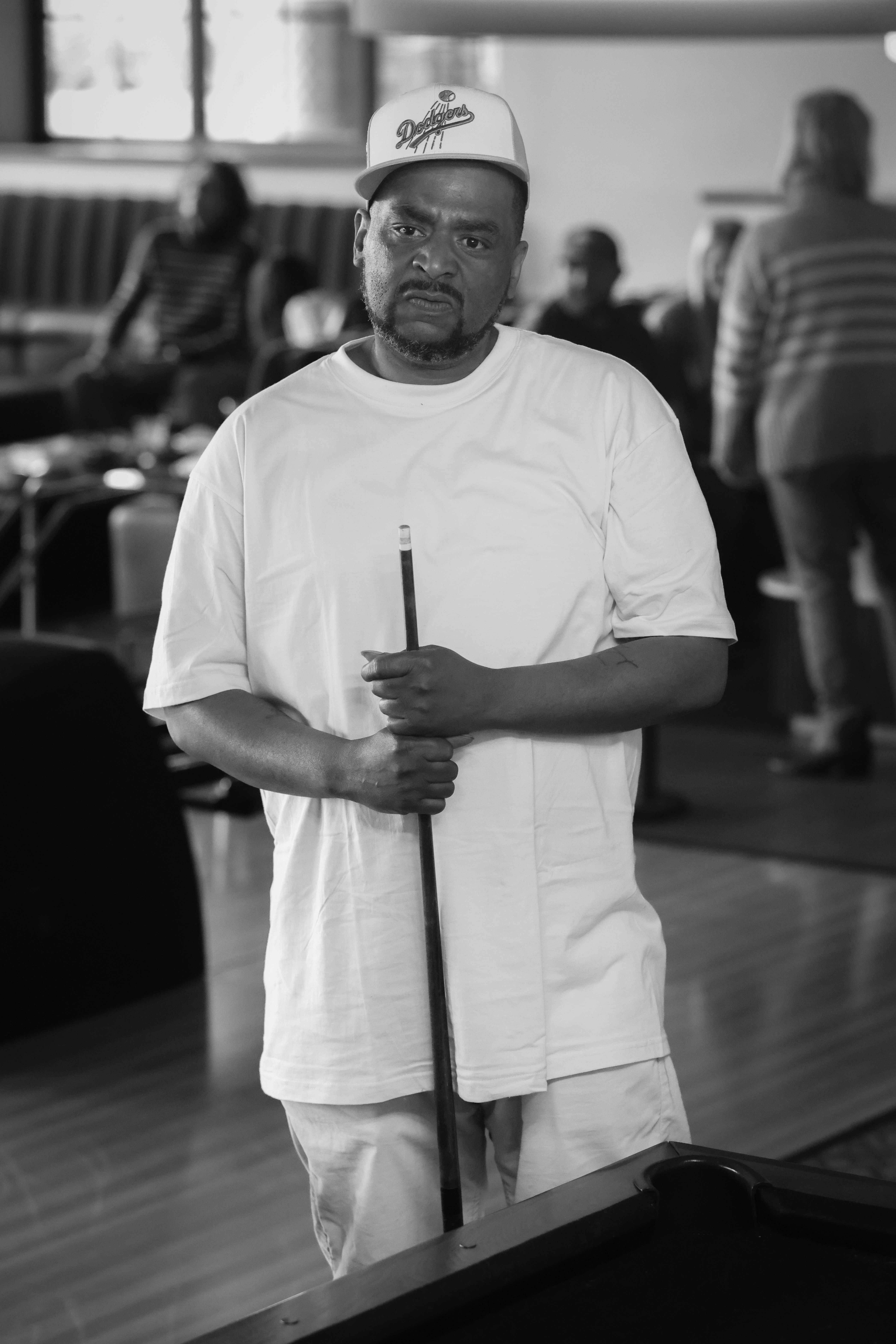 Man holding pool stick