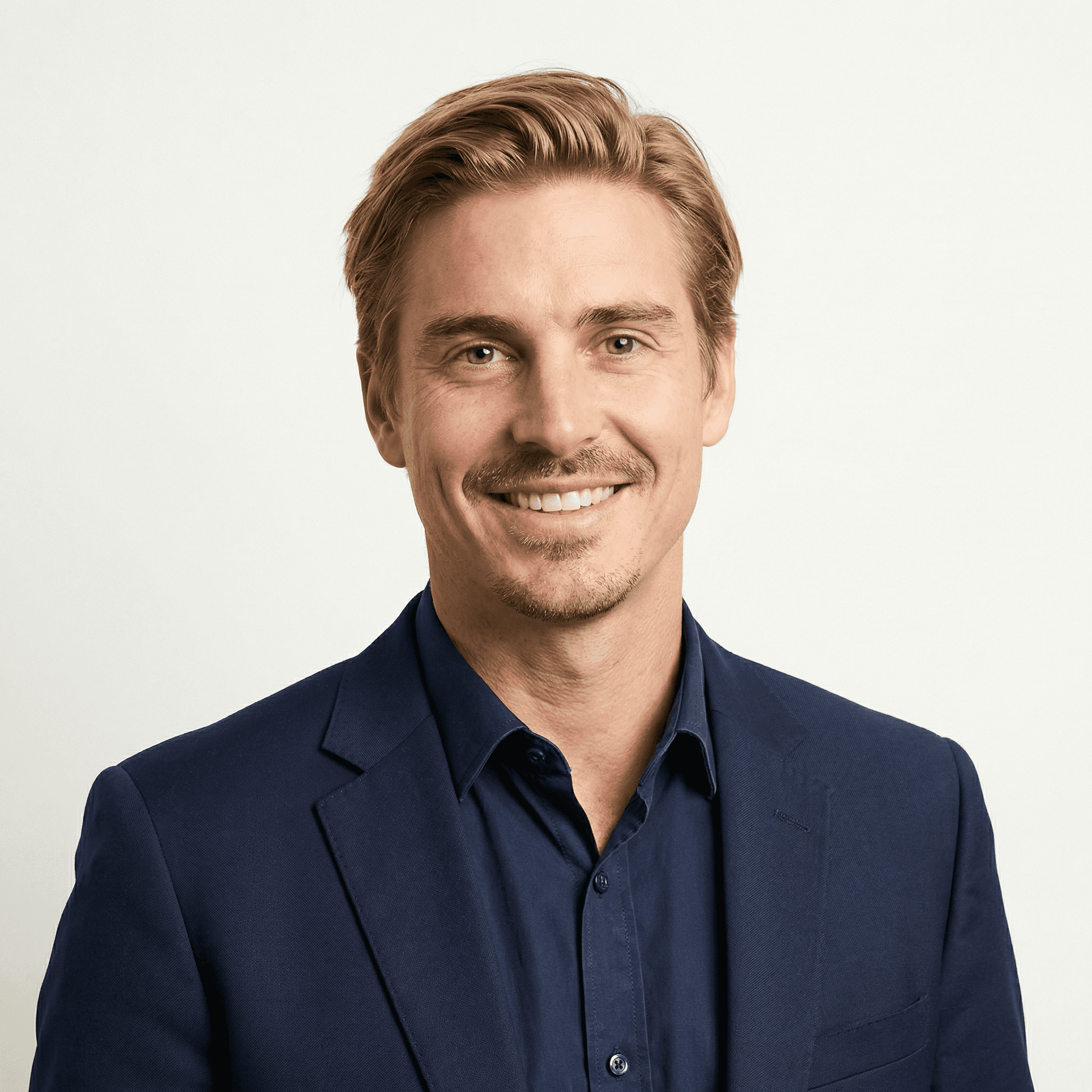 headshot of male in dark background