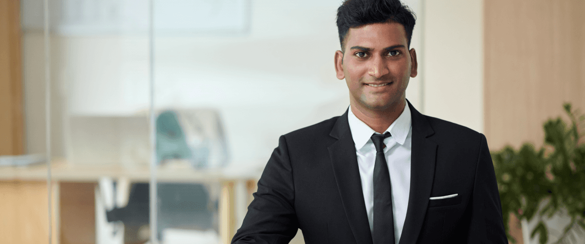 A confident HR professional smiling, representing the use of corporate video ads for hiring.
