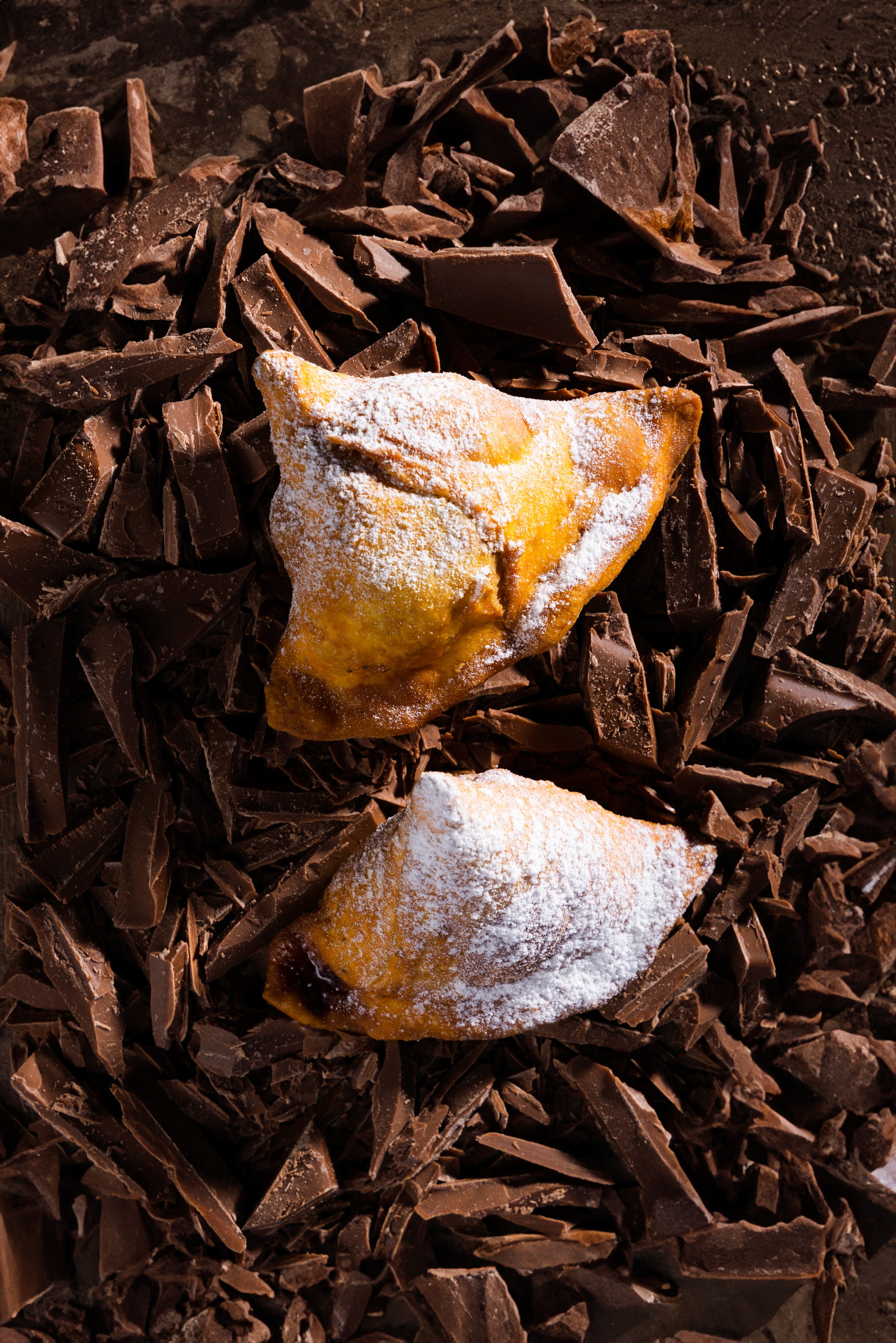 A bartender pouring liquor into a shot glass