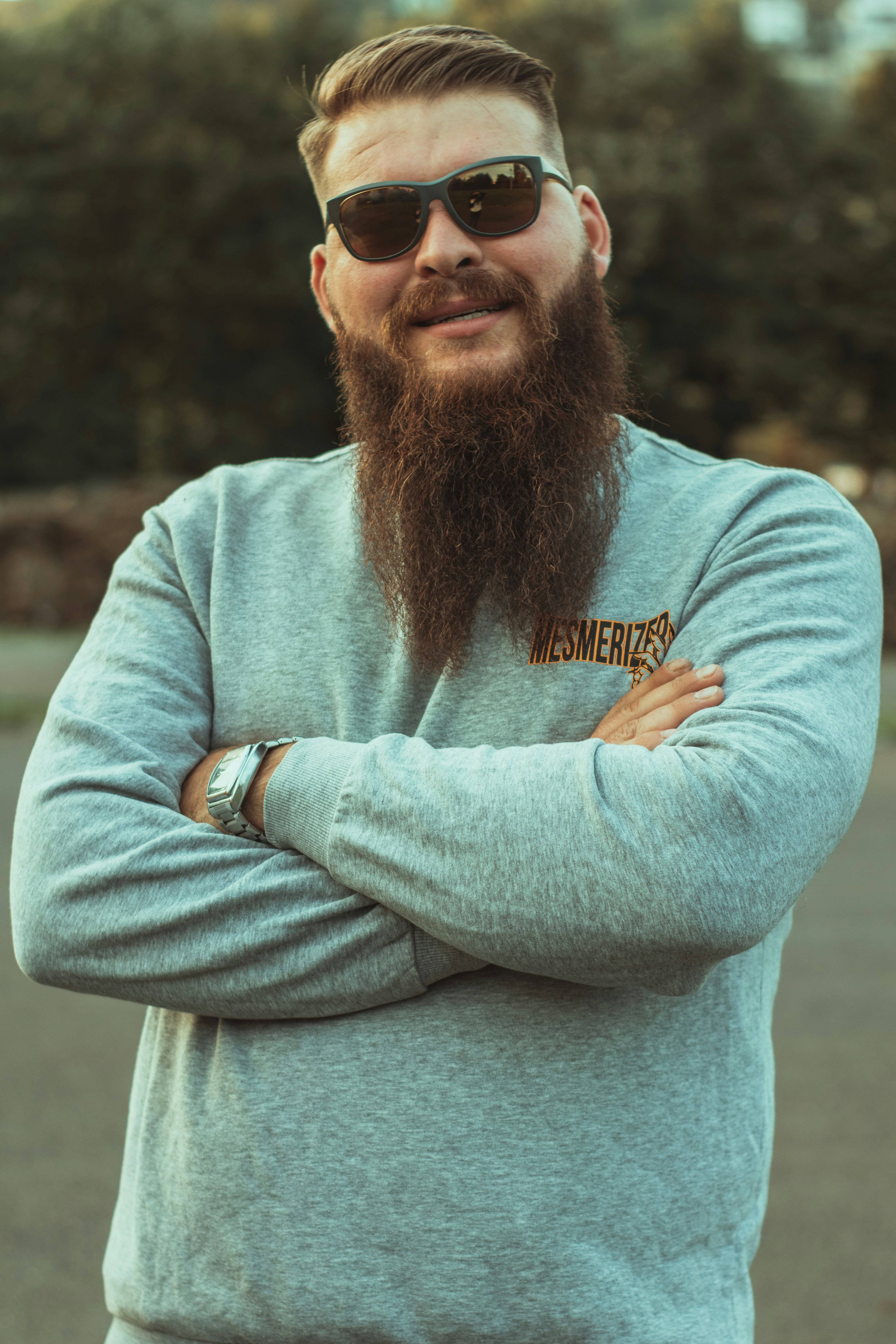 a man with a long beard wearing sunglasses