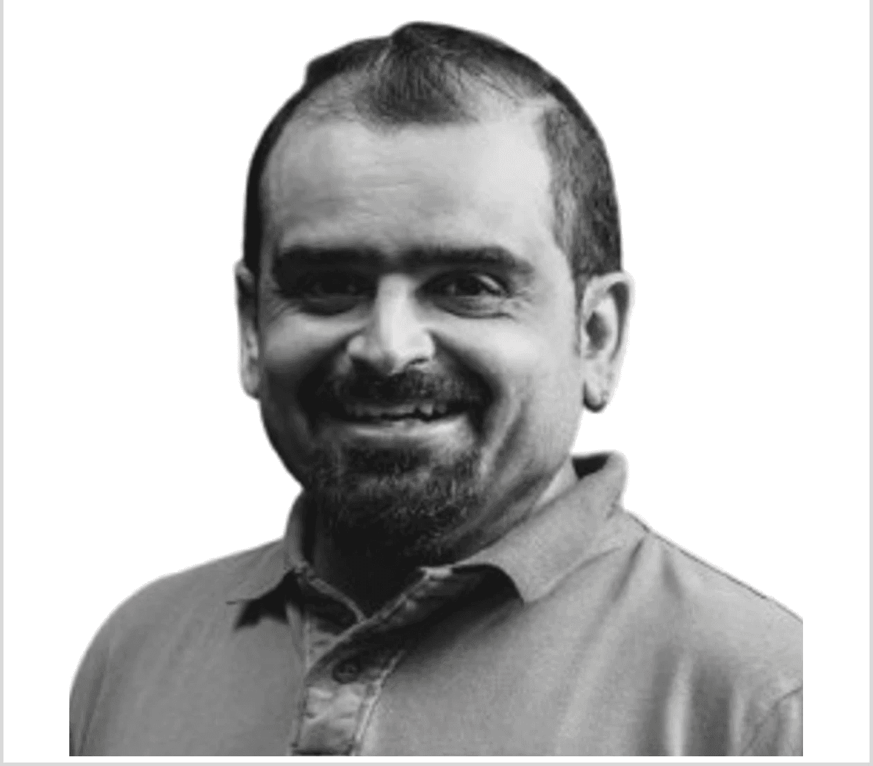 woman in black blazer covering her face with her hand