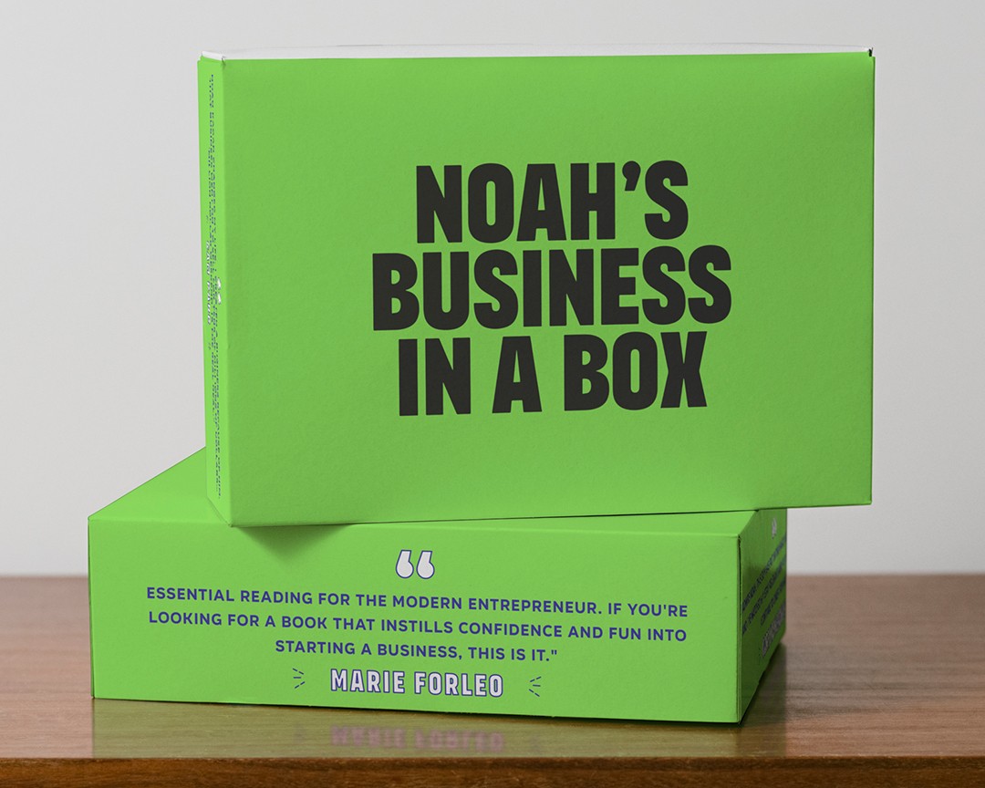 A modern green chair with a curved design and dark wooden legs against a dark background.