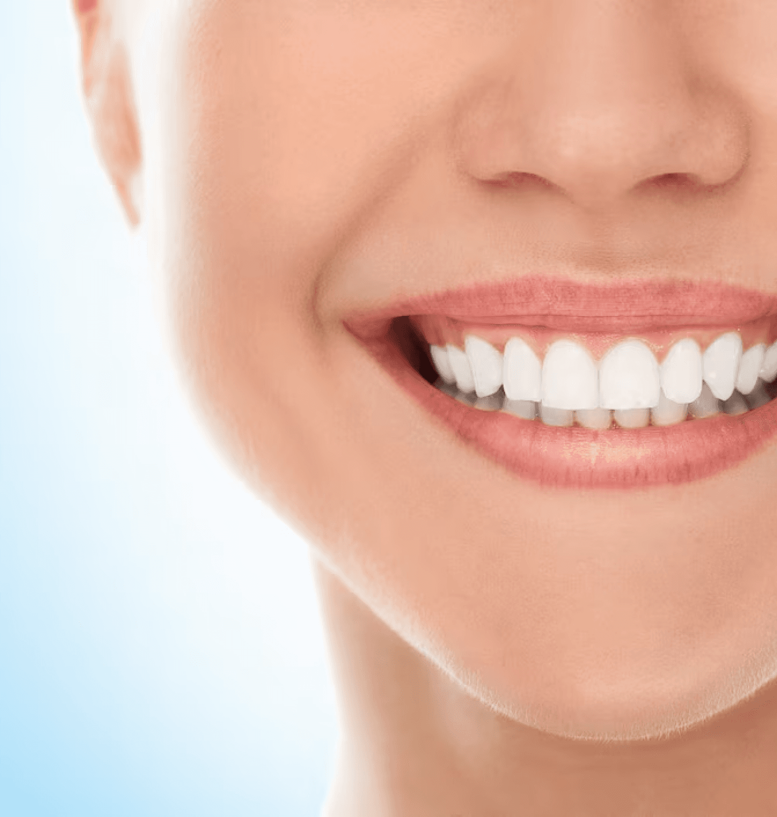 A close-up of a person's healthy, bright smile, showcasing well-aligned teeth.