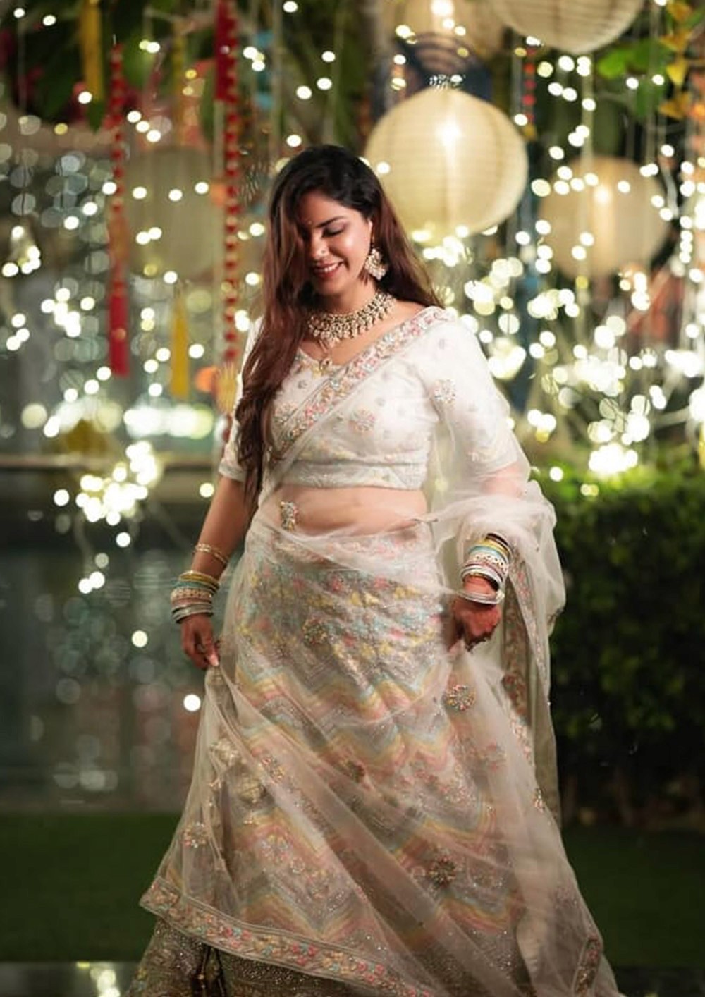 A close-up image showcasing a pair of elegant high heels with a glossy finish and intricate embellishments, paired with sparkling jewelry.