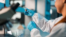 Young female scientist conducting research in a lab
