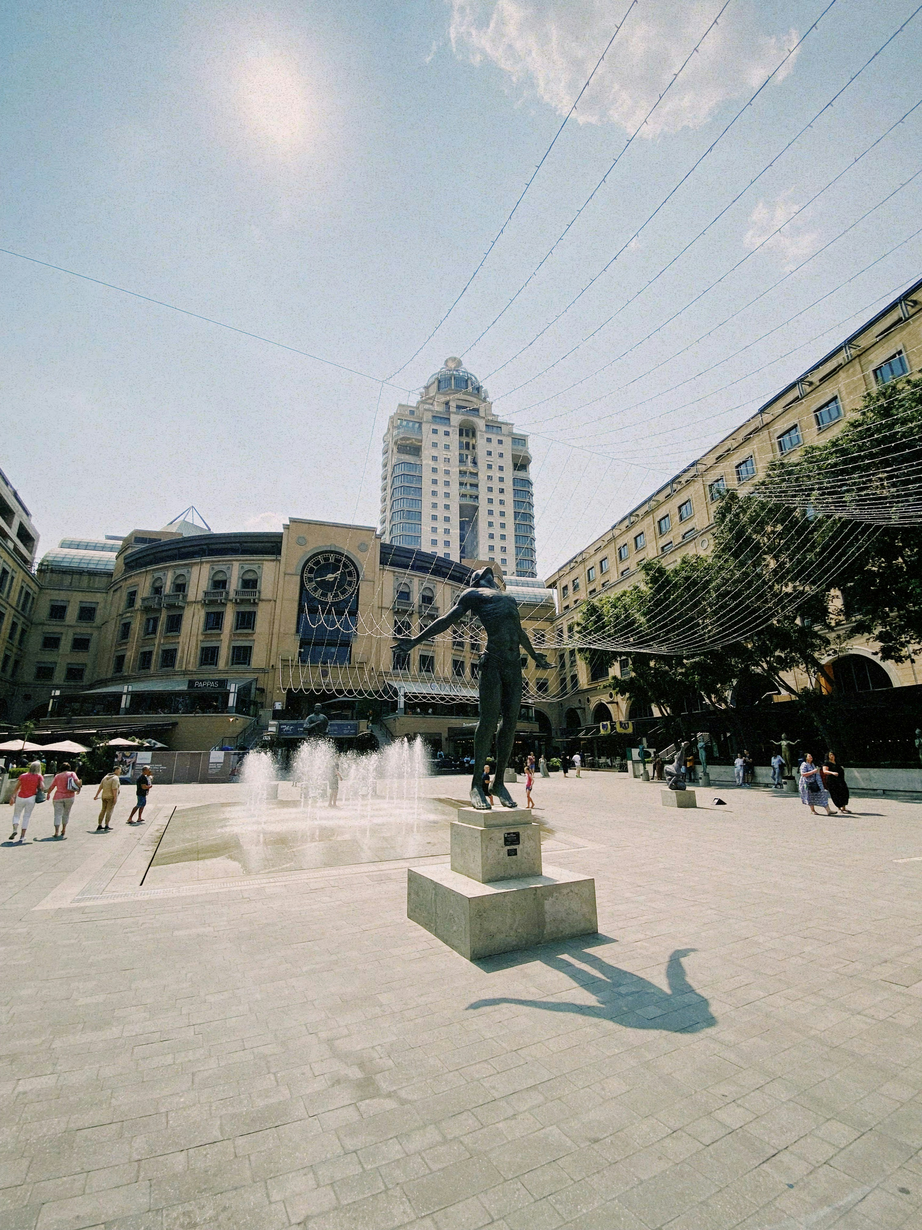 a statue of a man is in the middle of a square