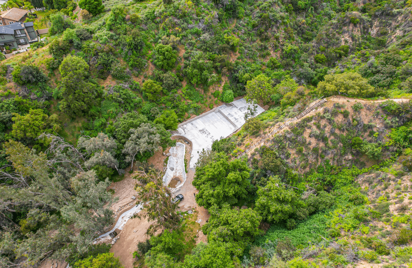 Aerial view of a concrete slab and surrounding hillside at the Stonehouse Road project
