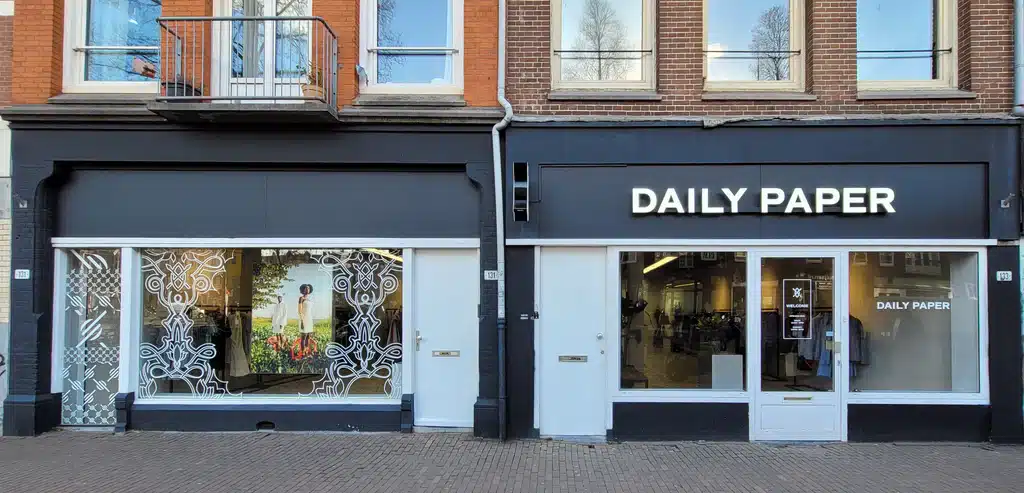 Daily Paper store front with black facade and shop windows on an Amsterdam street