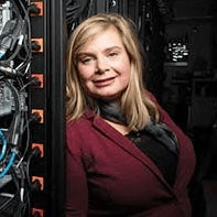 An image of Sabra Schneider looking at the camera