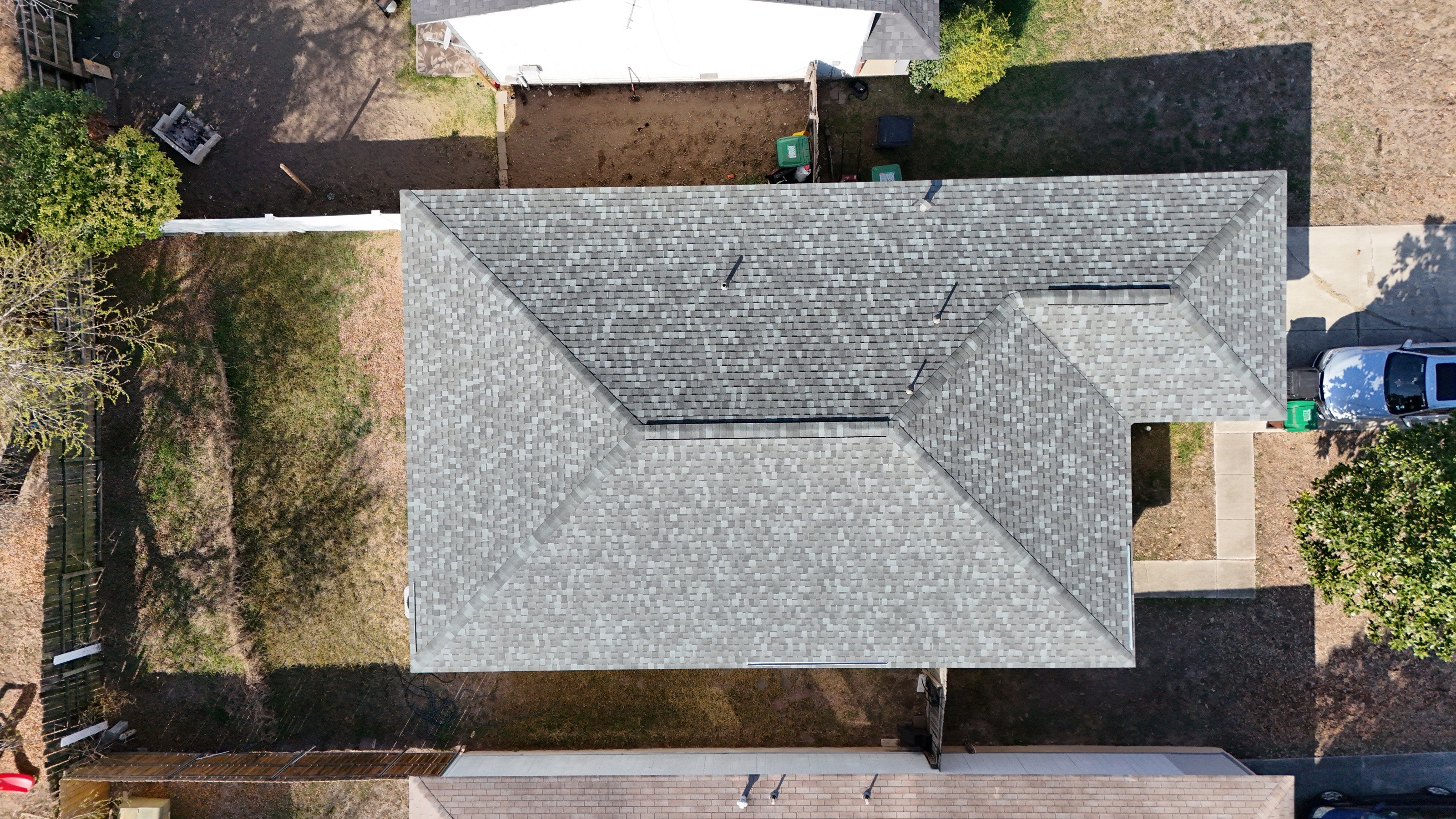 Overhead view of the Atlas Coastal Granite shingle roof on our San Antonio project, showing ridges, hips and vents.