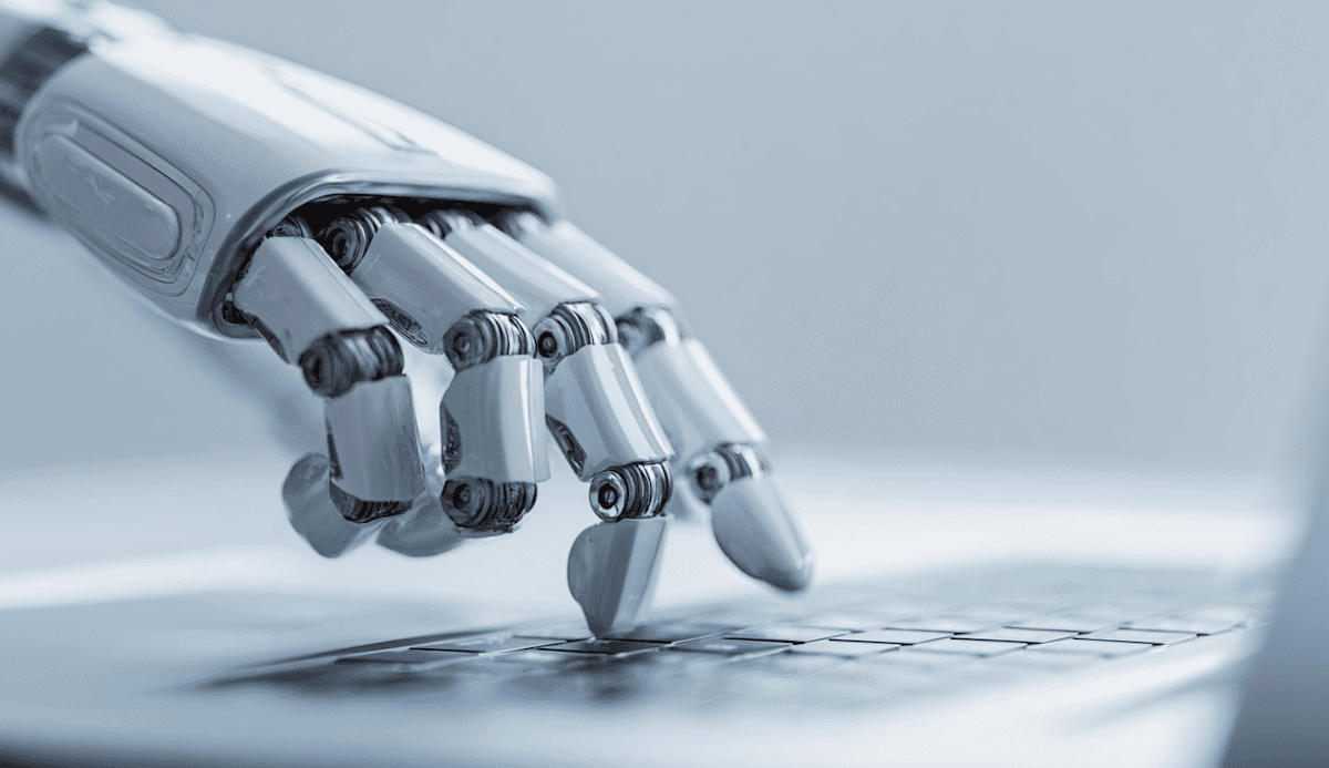 A laptop computer sitting on top of a wooden table