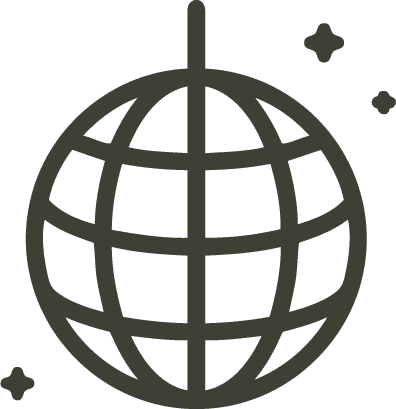 A serene outdoor wedding setup with white chairs arranged on green grass under a canopy of trees.