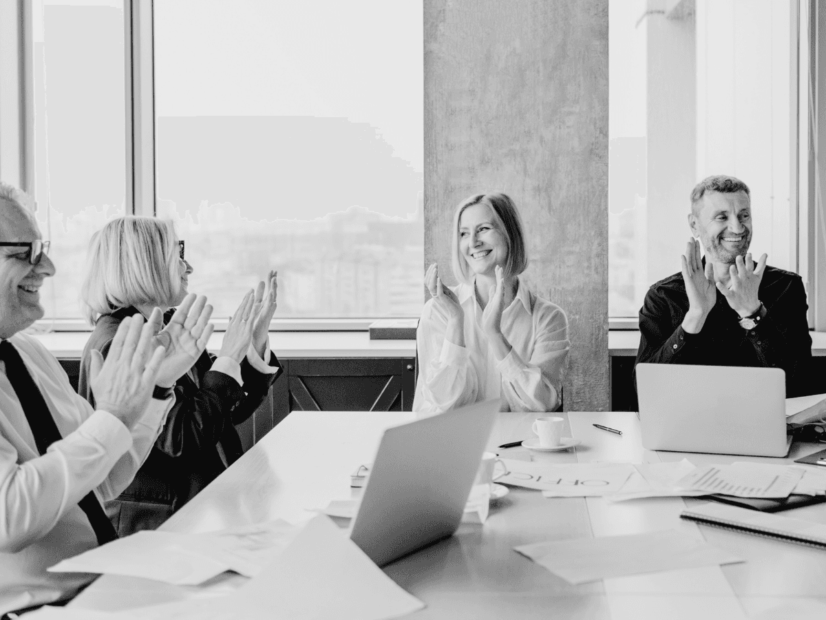 Team working in an office watching at a presentation