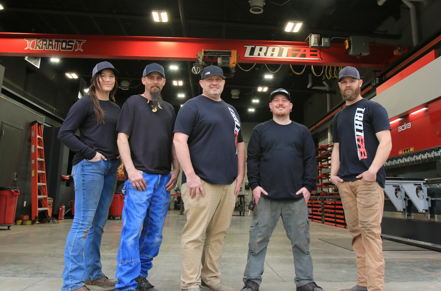 5 Members of the TratFab Team in front of the new shop in Star Idaho.  Kratos Beam Crane in the background is stong enough to lift the world!