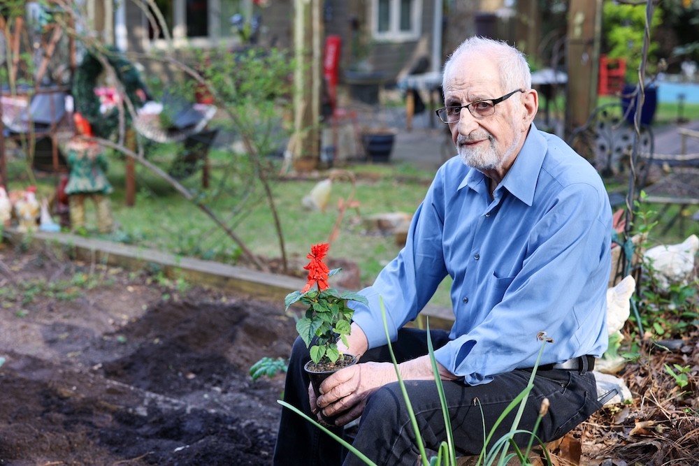 Bubjan with book and speaking to camera