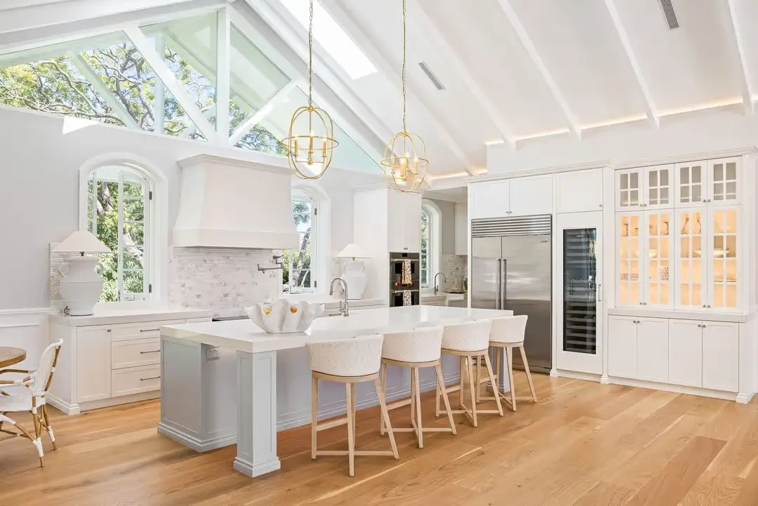 Kitchen in Jacaranda House with custom joinery and island bench with stools