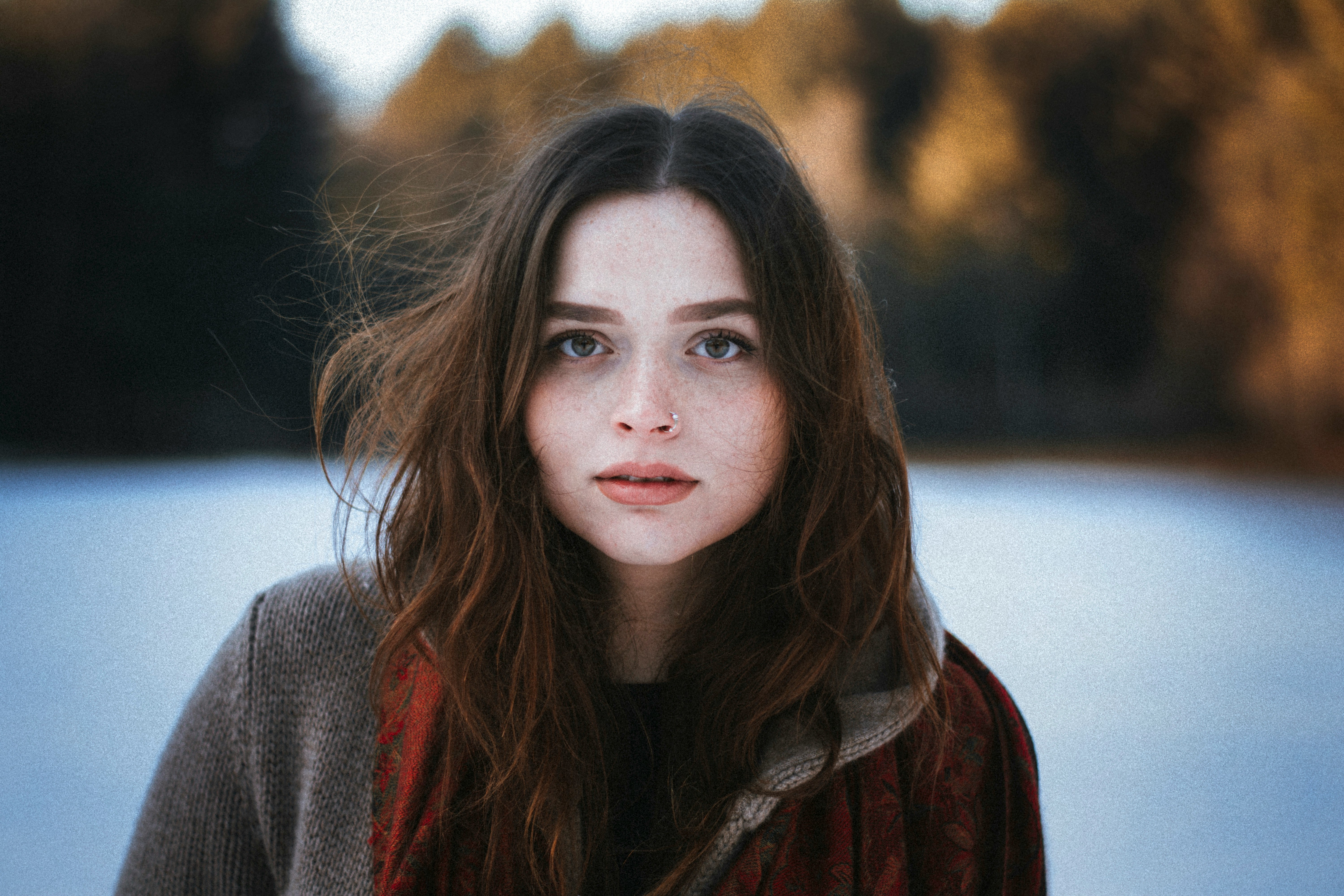 woman enjoying snow - What Colors Look Good on Pale Skin