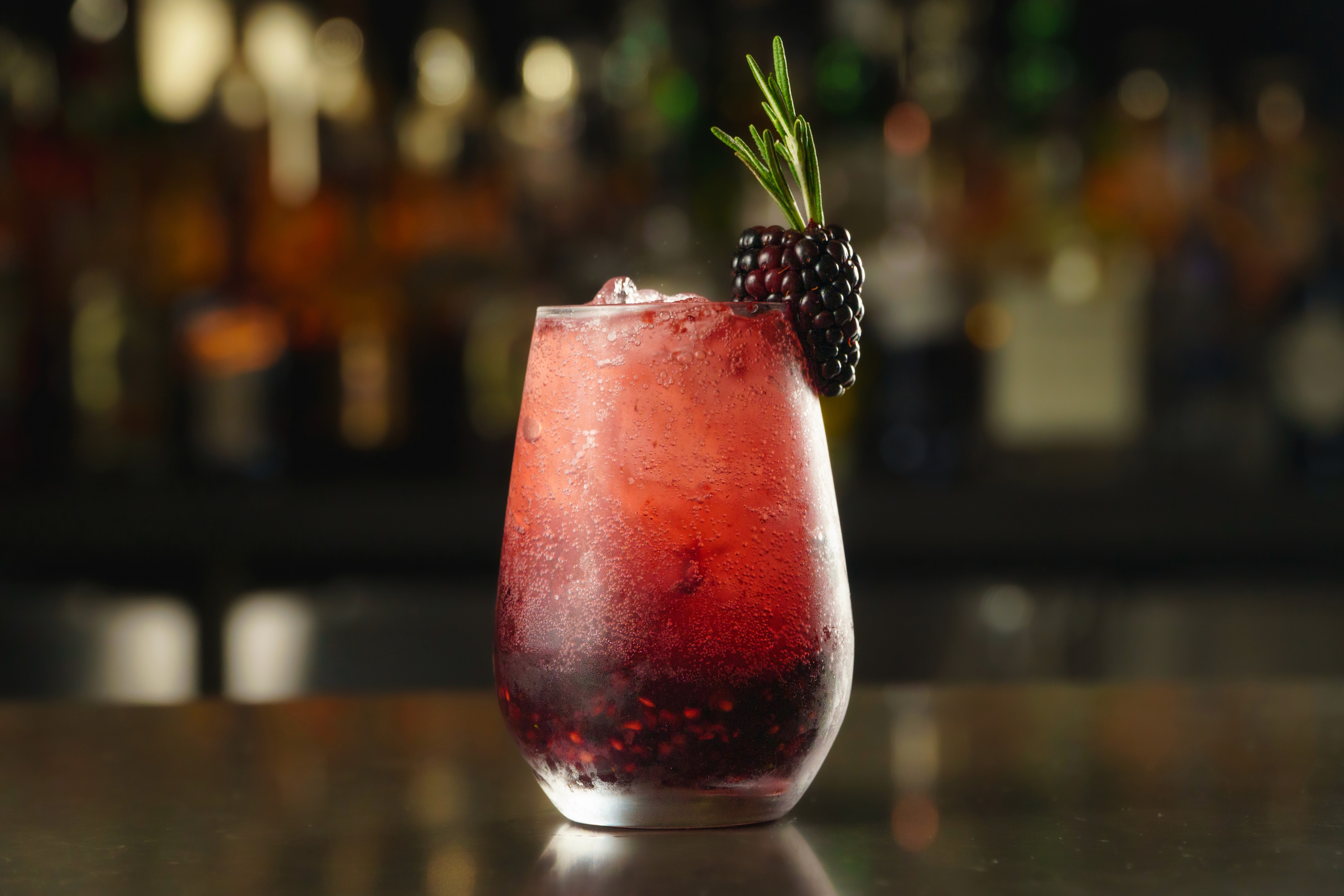 a cocktail glass with a cherry