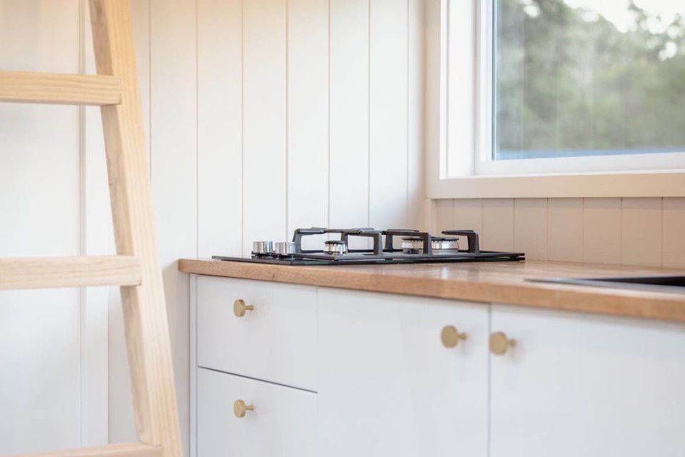 Compact kitchen design in Sharper Tiny Homes 6m single level design