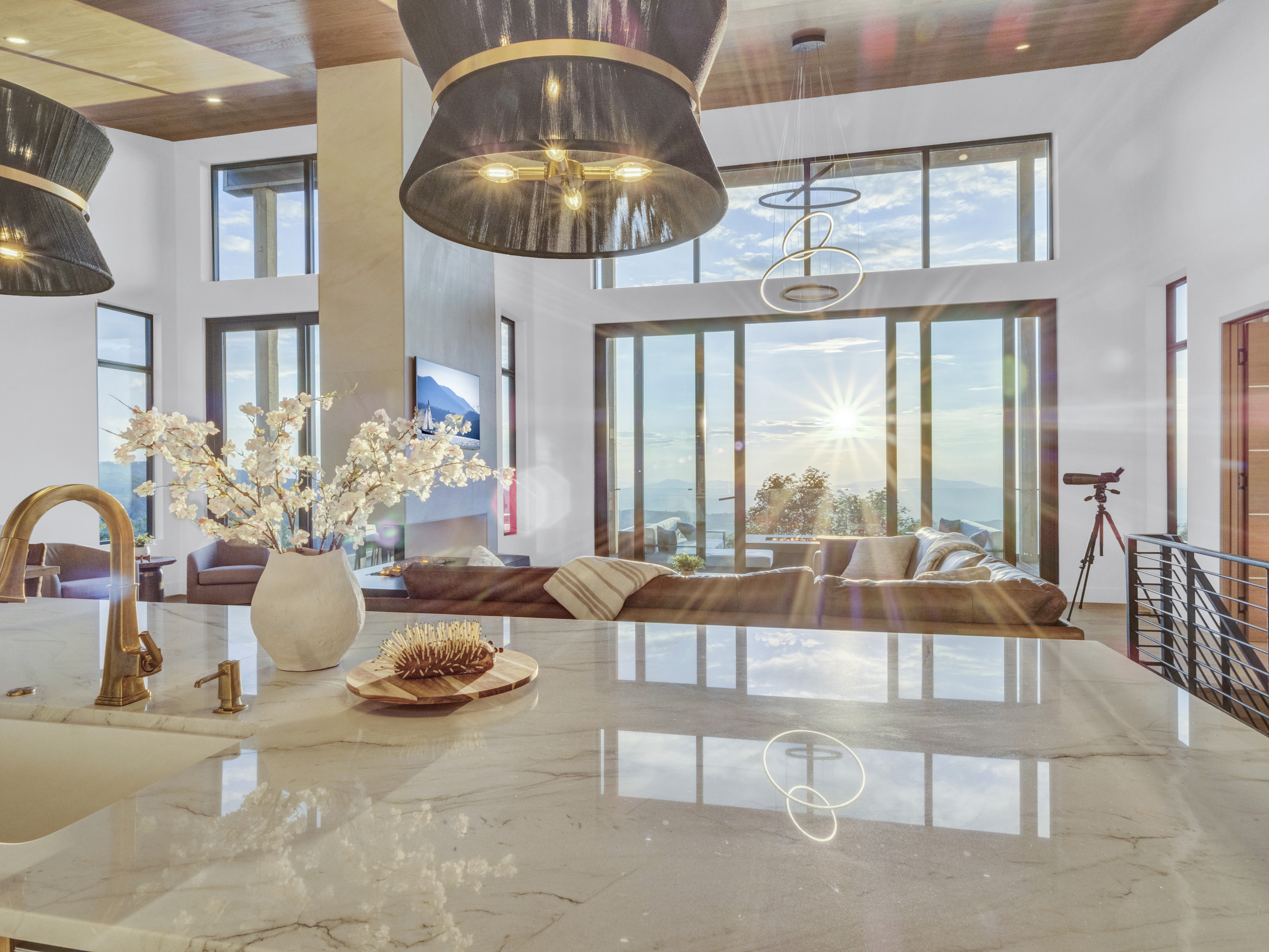 A cinematic shot showing the sunset reflection on the marble island with warm interior lighting and mountain views