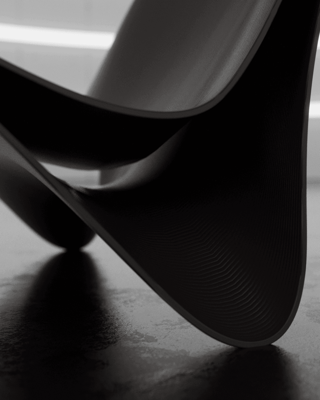 Dramatic moody curves of the Curva Chaise designed by noknok studio