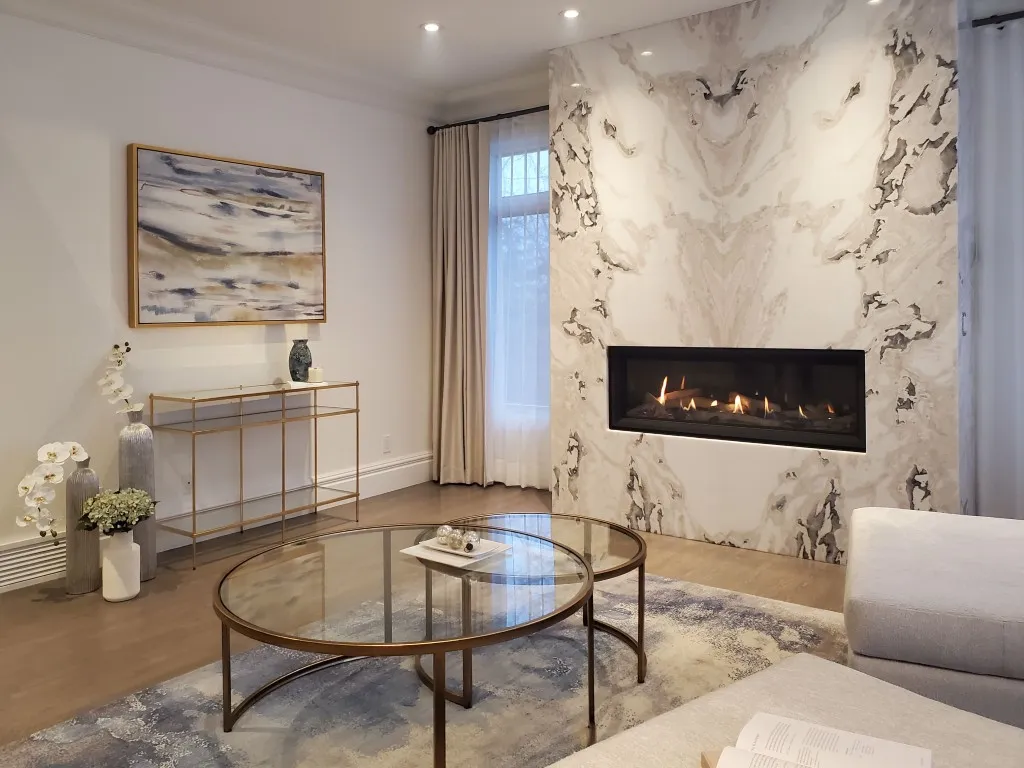 Image of Luxury living room design with marble fireplace, custom layout, and elegant furniture by KHD Homes.