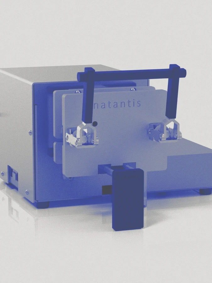 Natantis laboratory testing device with mechanical clamp system, illustrating precision engineered medical hardware and enclosure design.
