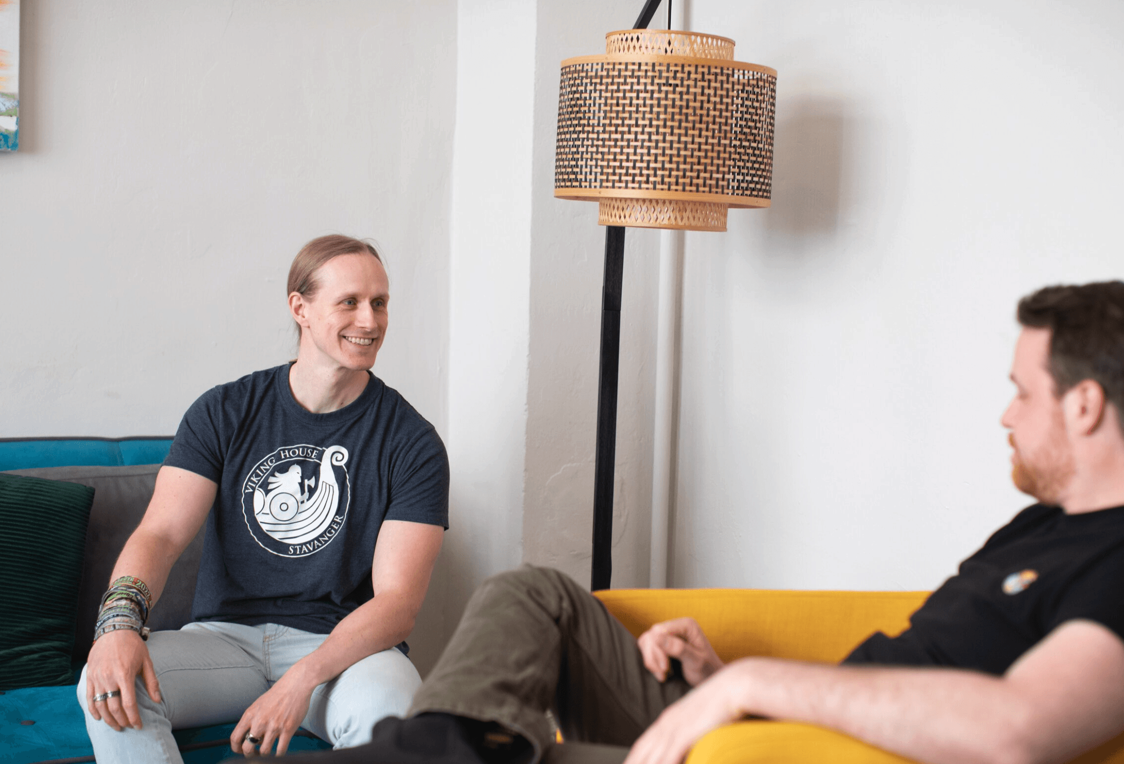 person sitting in a chair in front of a man
