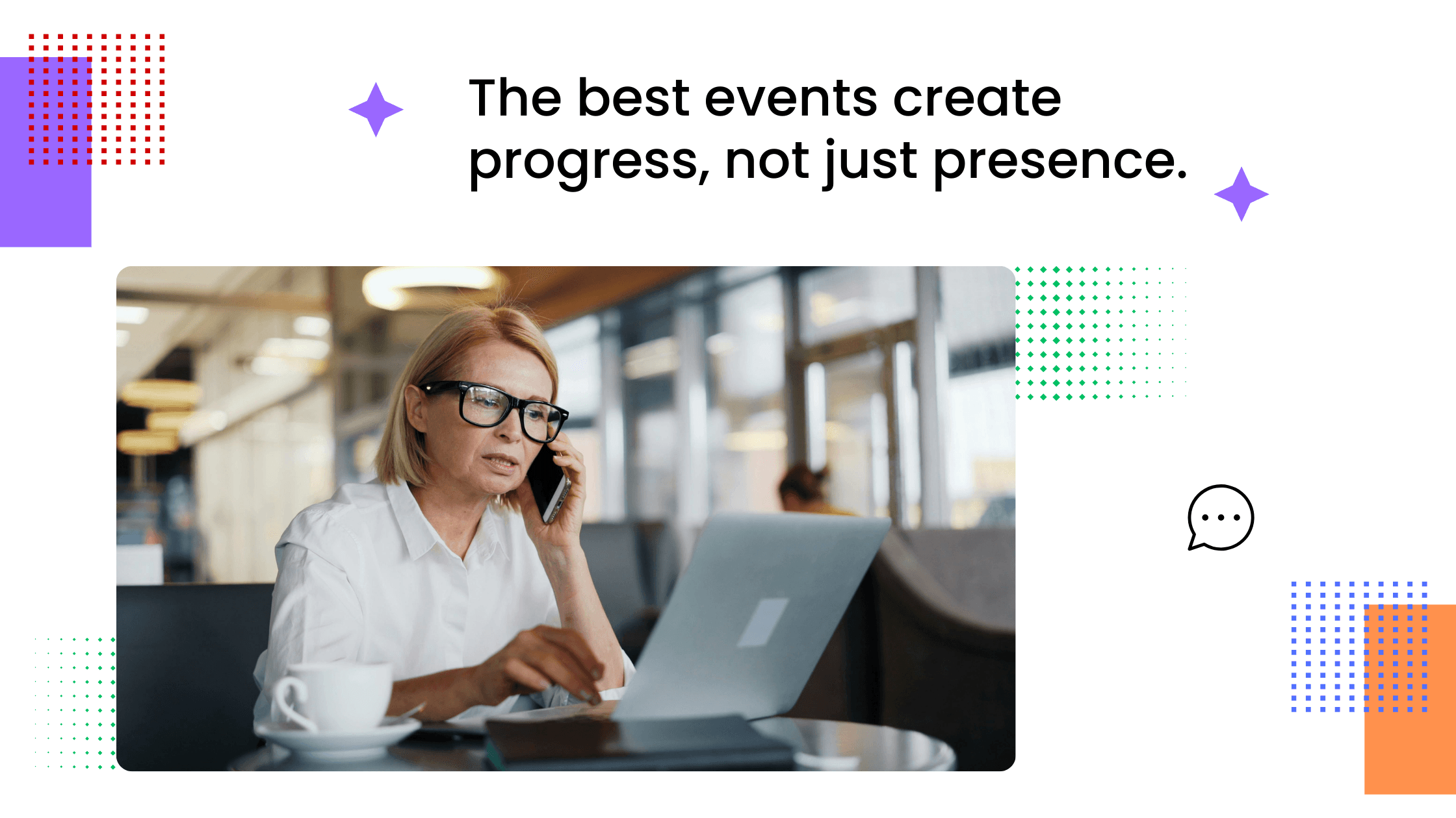 A coach working on a laptop at a café table, wearing glasses and focused on her screen.