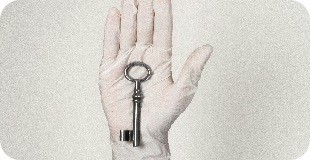 person wearing white shorts with black bracelet