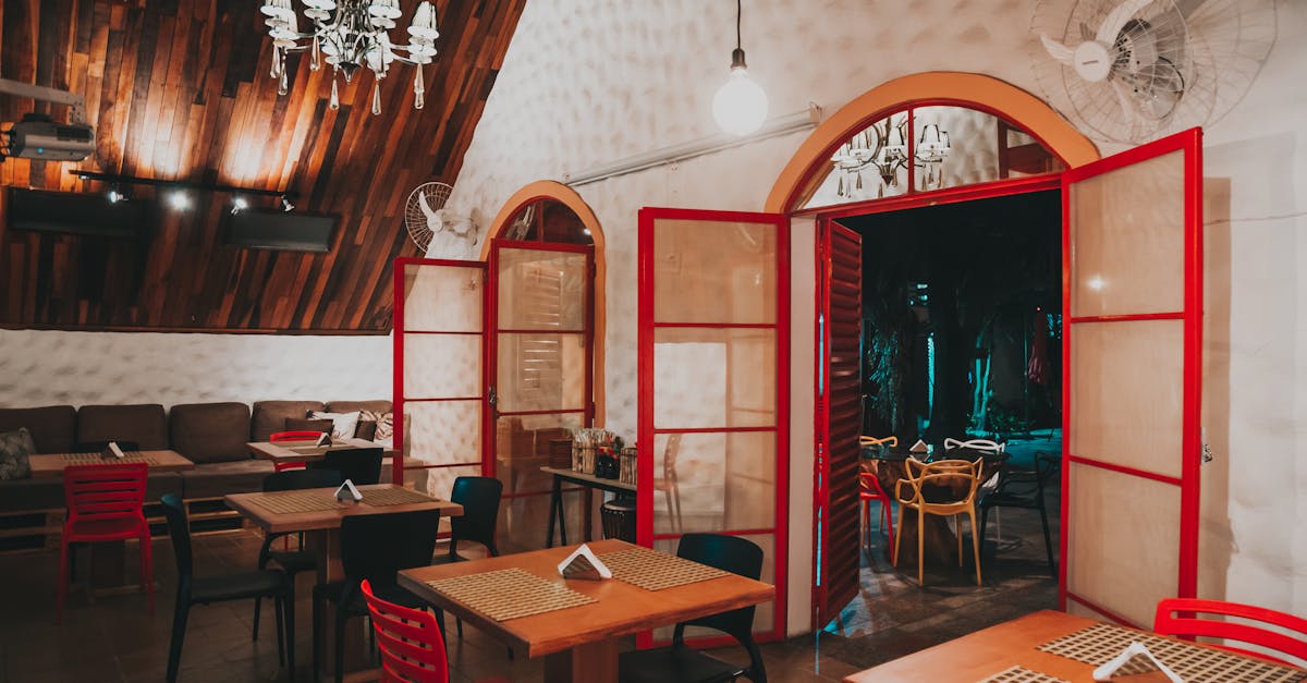 Warm and inviting restaurant interior featuring wooden details and red accents for a cozy atmosphere