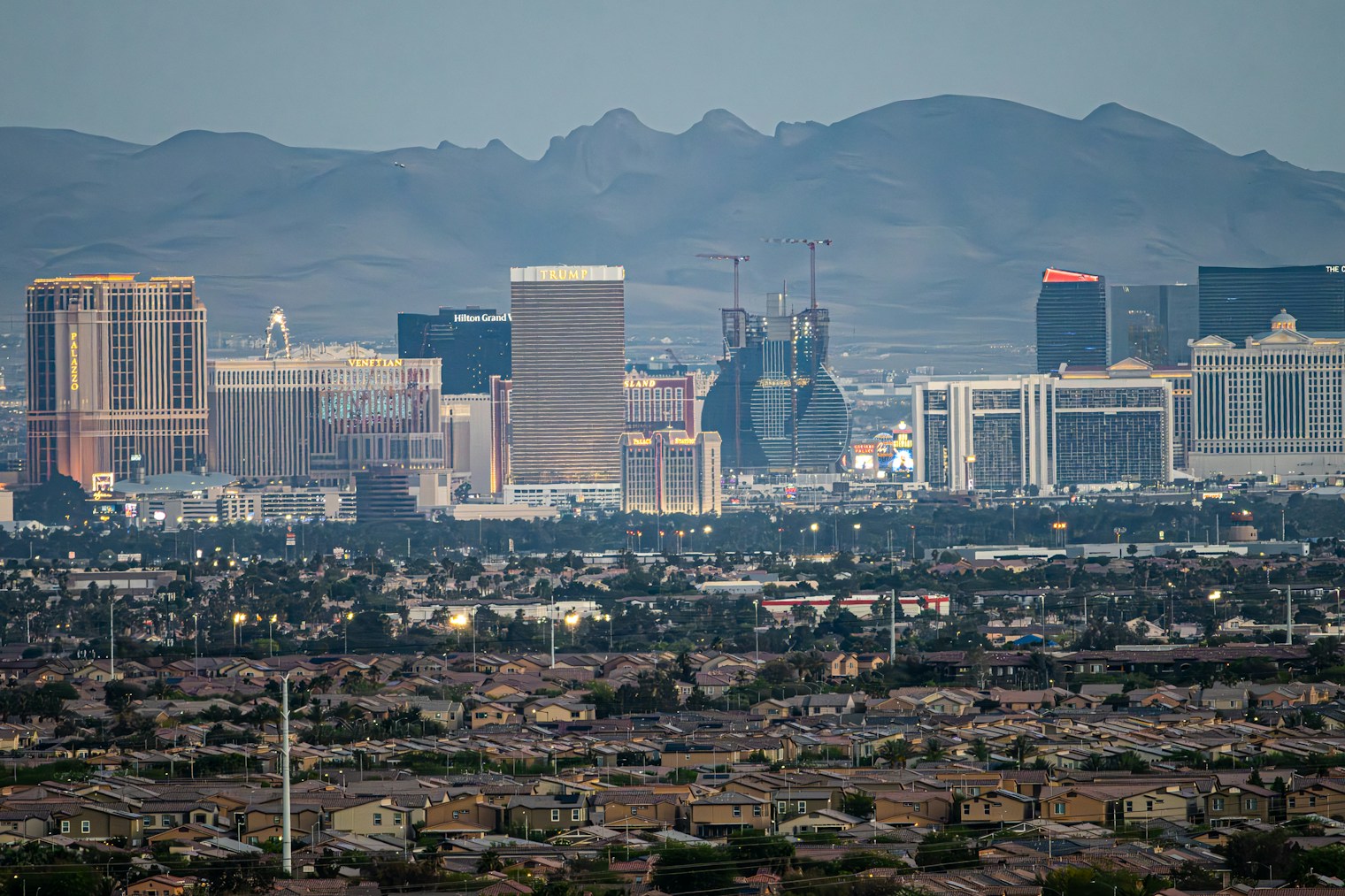 Las Vegas cityscape at dusk with the mountains beyond