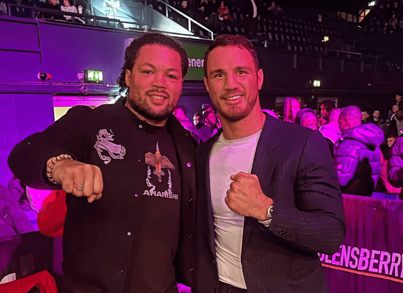 Agron Smakici meeting event guests and industry peers, posing with fists up to show boxing community connections.