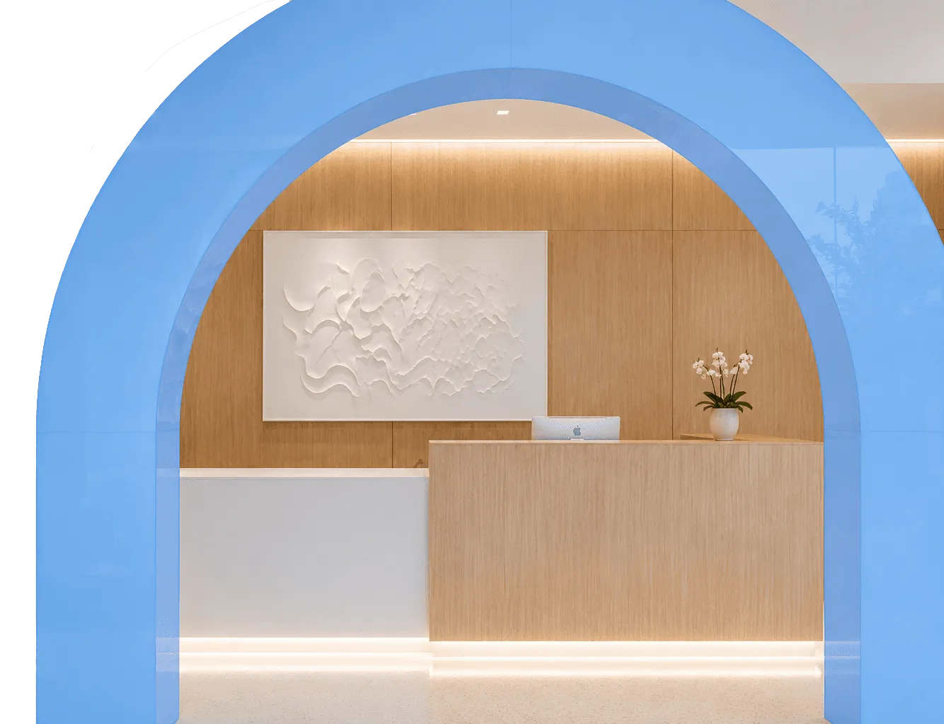 Modern reception desk with art and flowers