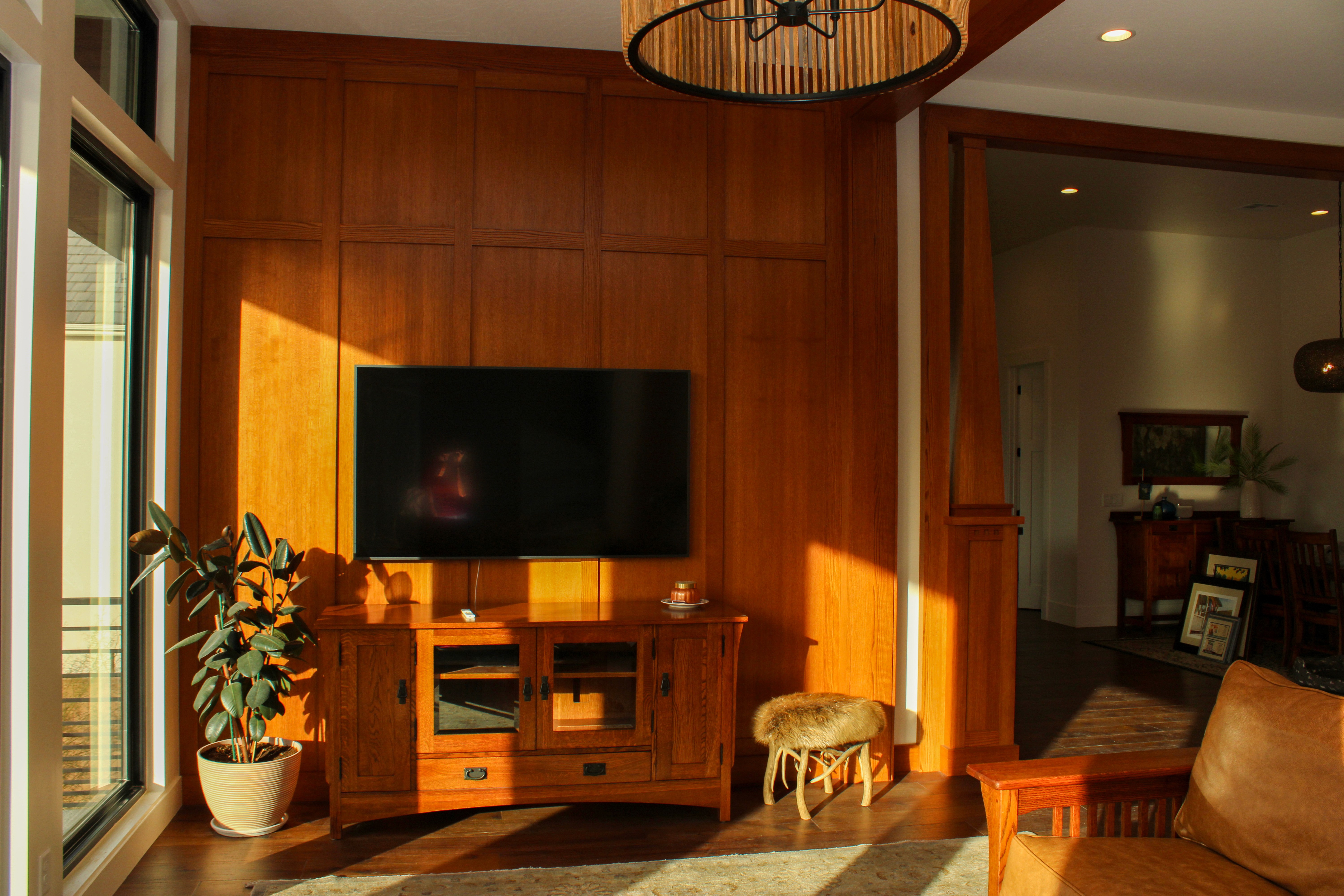 Living area with complete wood accent wall and warm, vintage 70s style in Southern Utah