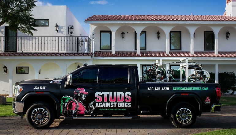 Studs Against Bugs bussiness truck from behind