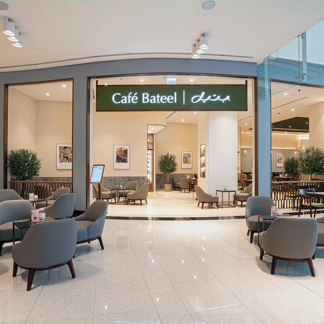 Café Bateel interior with warm lighting, elegant seating, and a cosy upscale atmosphere