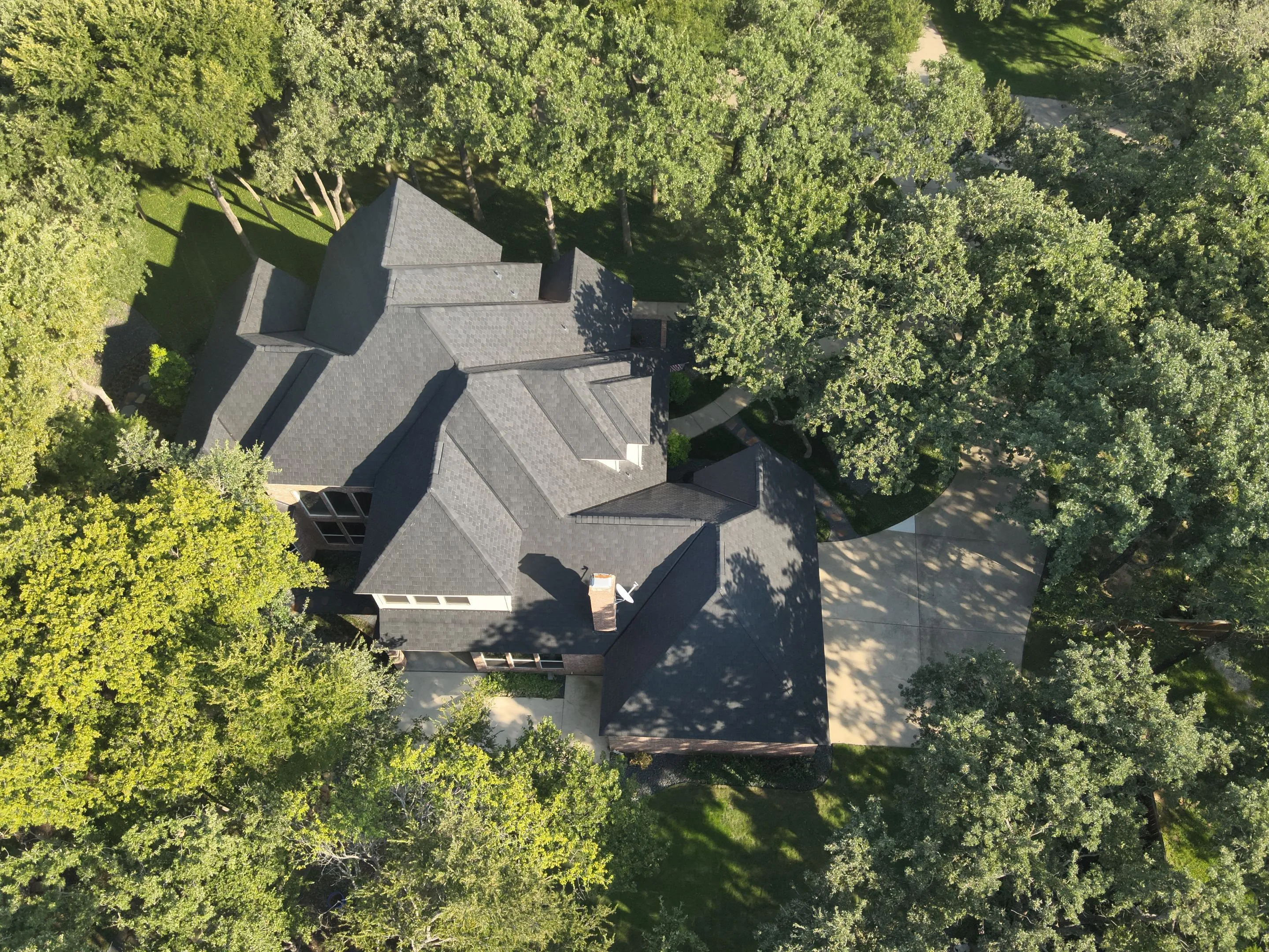Completed F-Wave synthetic roofing project on luxury brick home in Corinth Texas showing superior weather protection