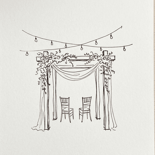 A serene outdoor wedding setup with white chairs arranged on green grass under a canopy of trees.