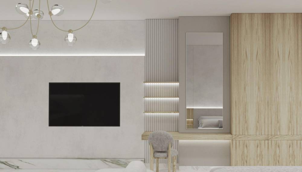 Interior of a contemporary bedroom with a bed and nightstand at Radiant Marina Towers.
