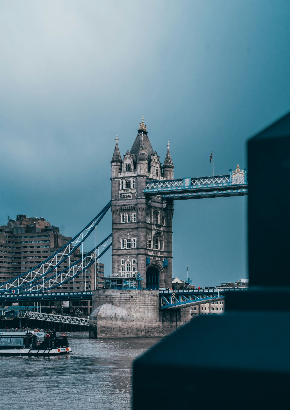a boat is in the water near a bridge