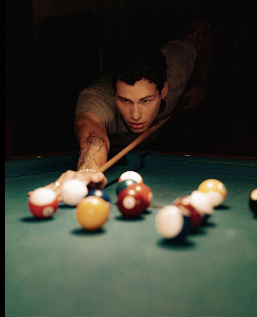 a woman holding a red flower