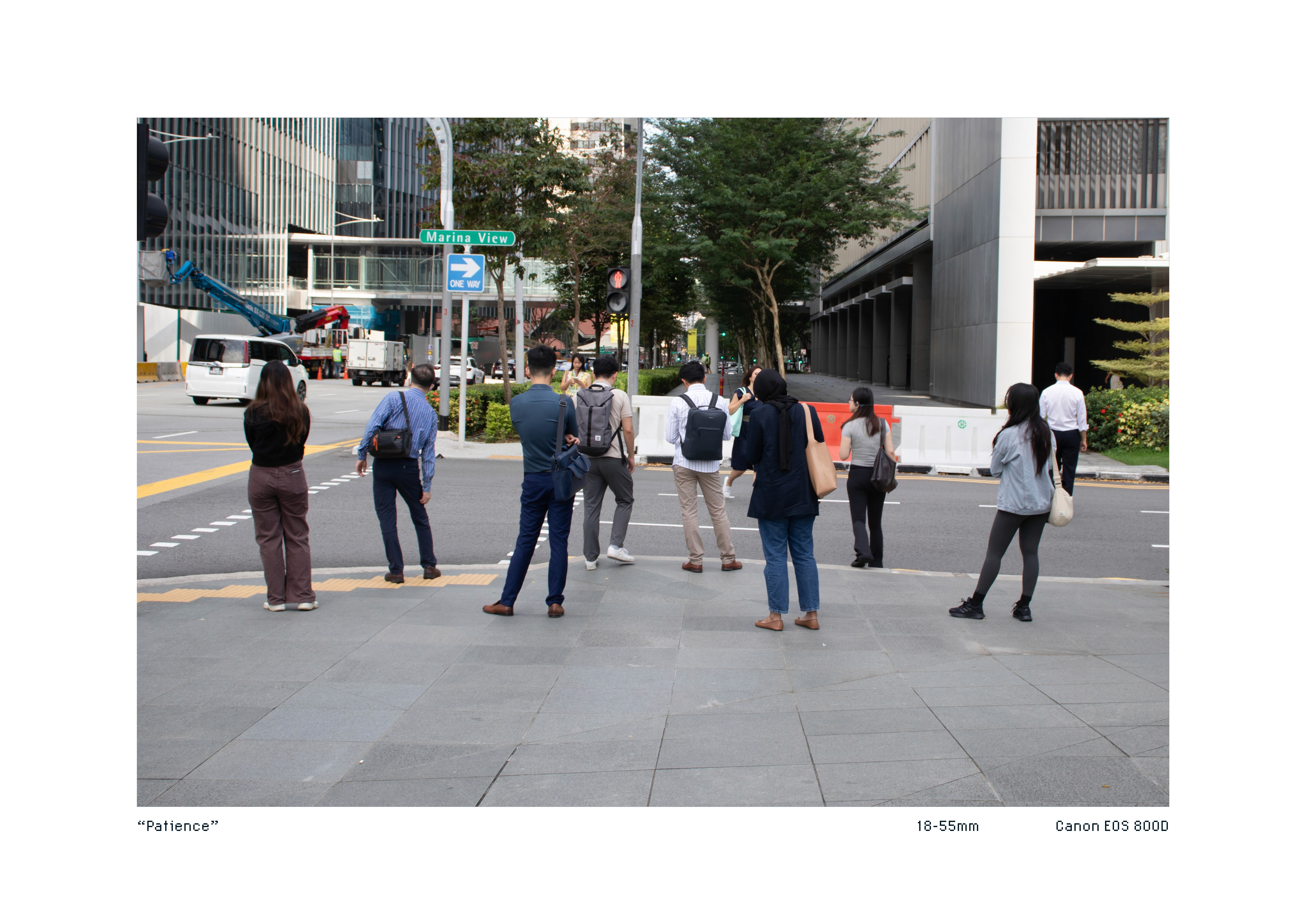 Pedestrians waiting for the traffic light to change
